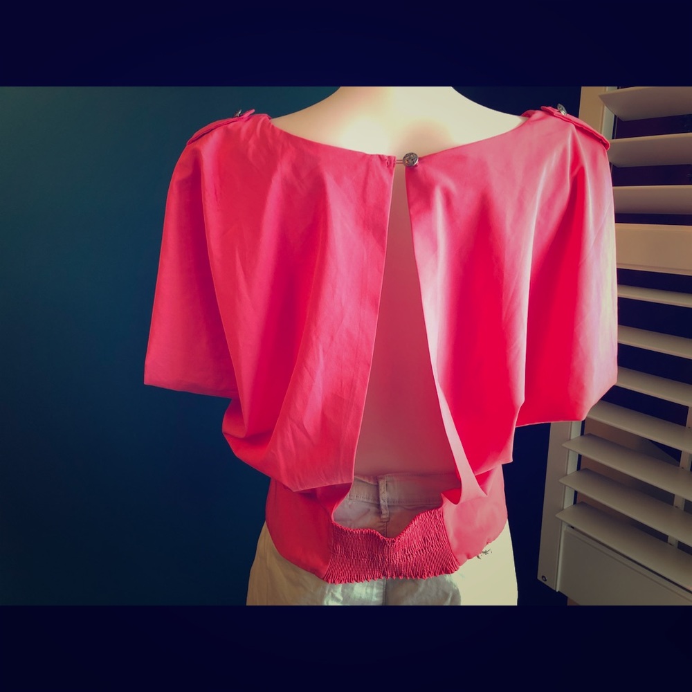 Pink backless blouse.